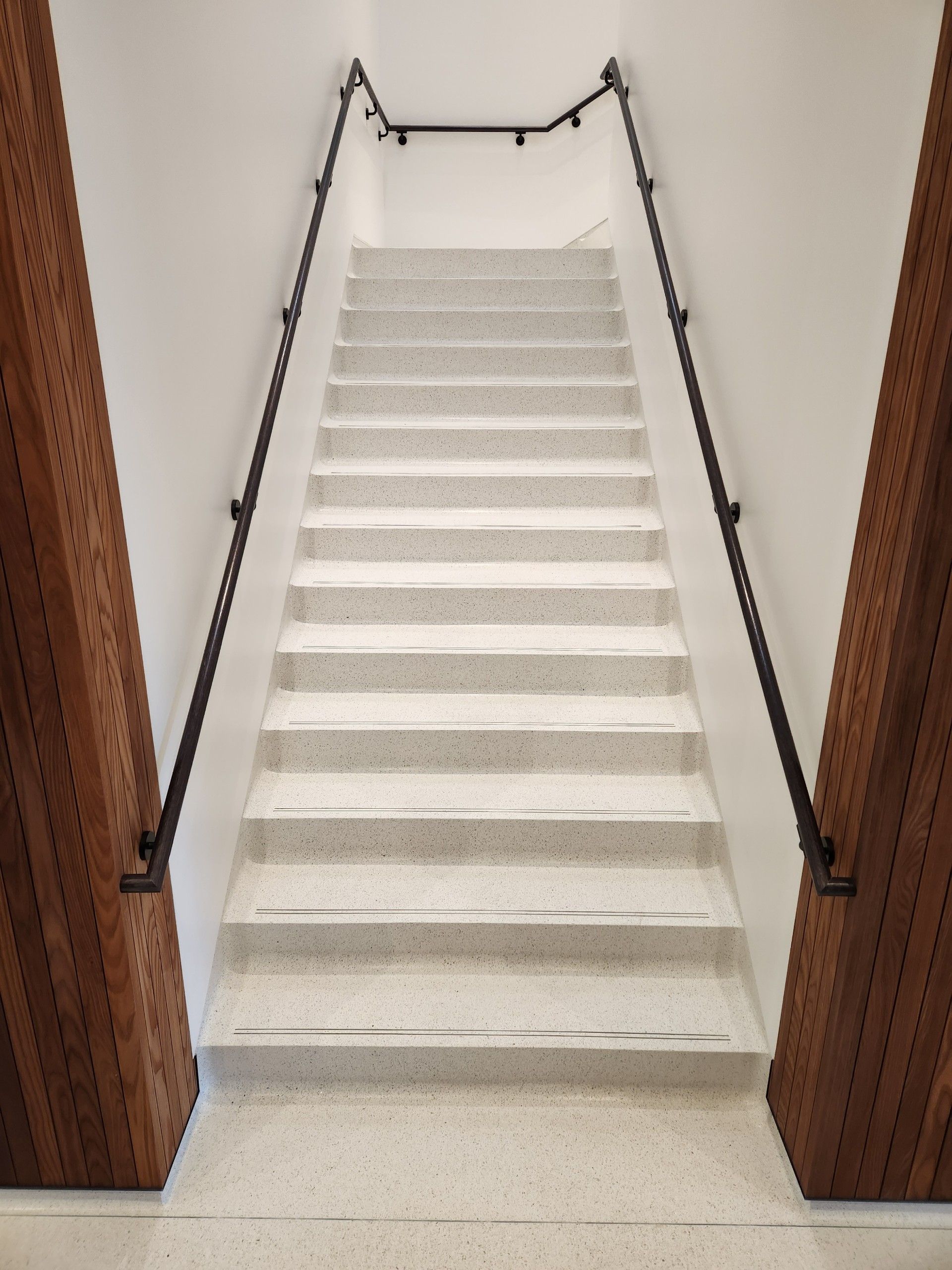A set of stairs leading up to the second floor of a building.