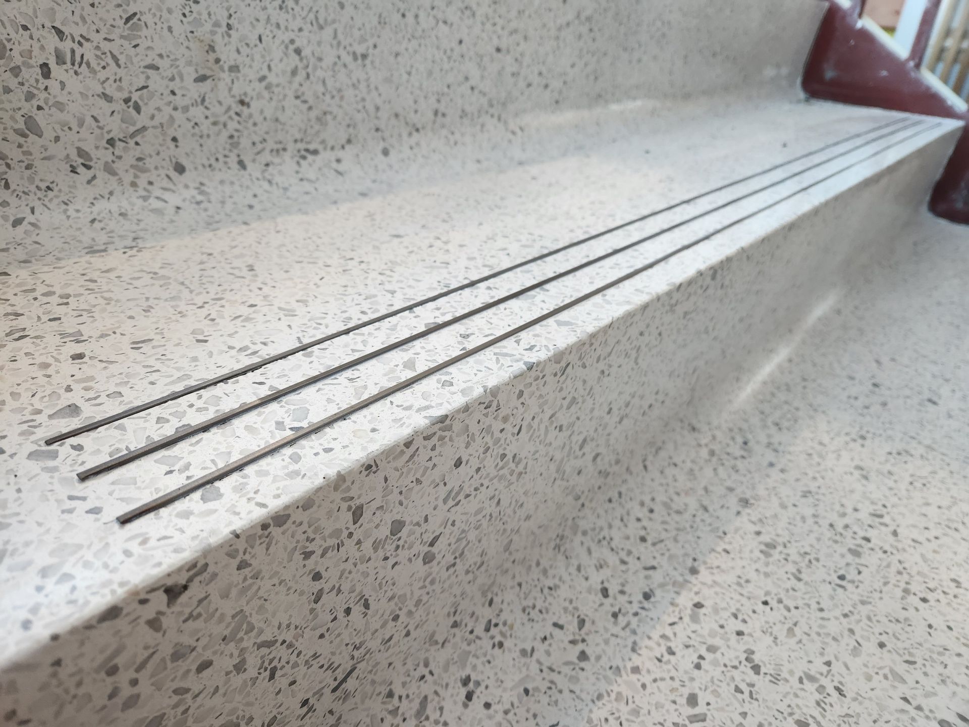 A close up of a staircase with a drain on it