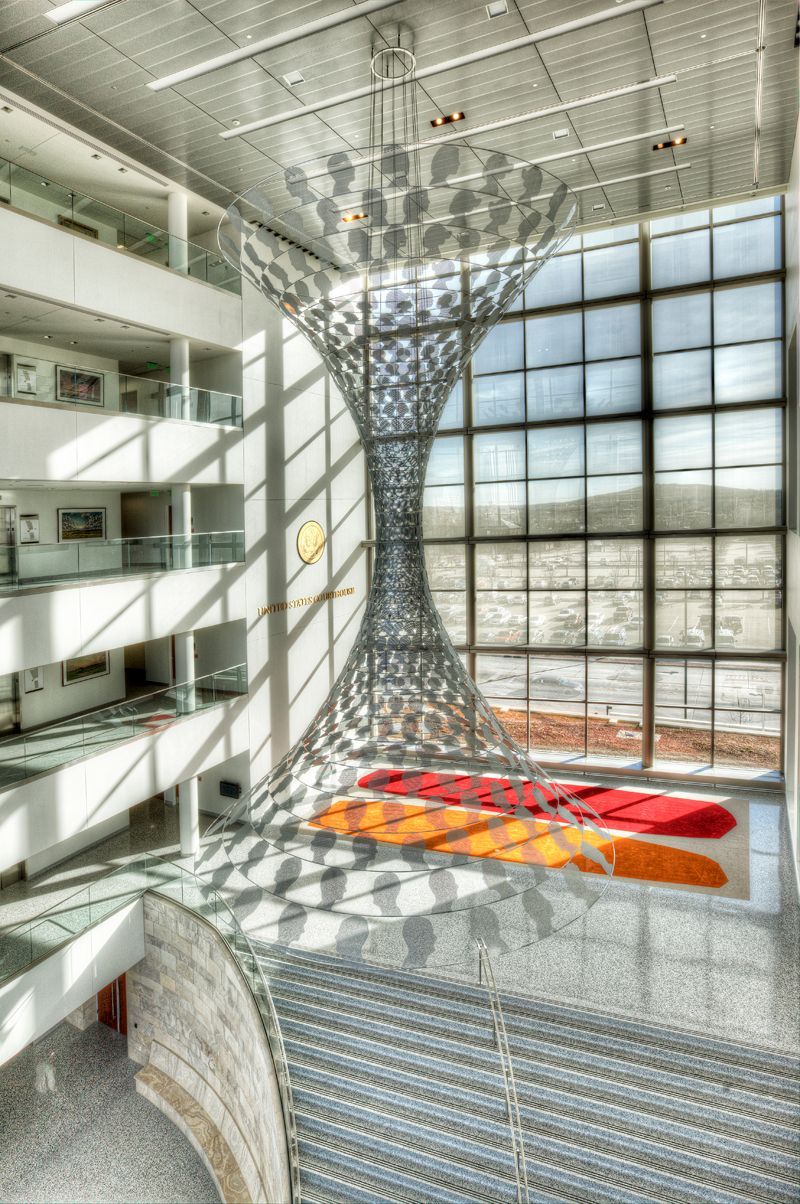 A large building with a sculpture in the middle of it