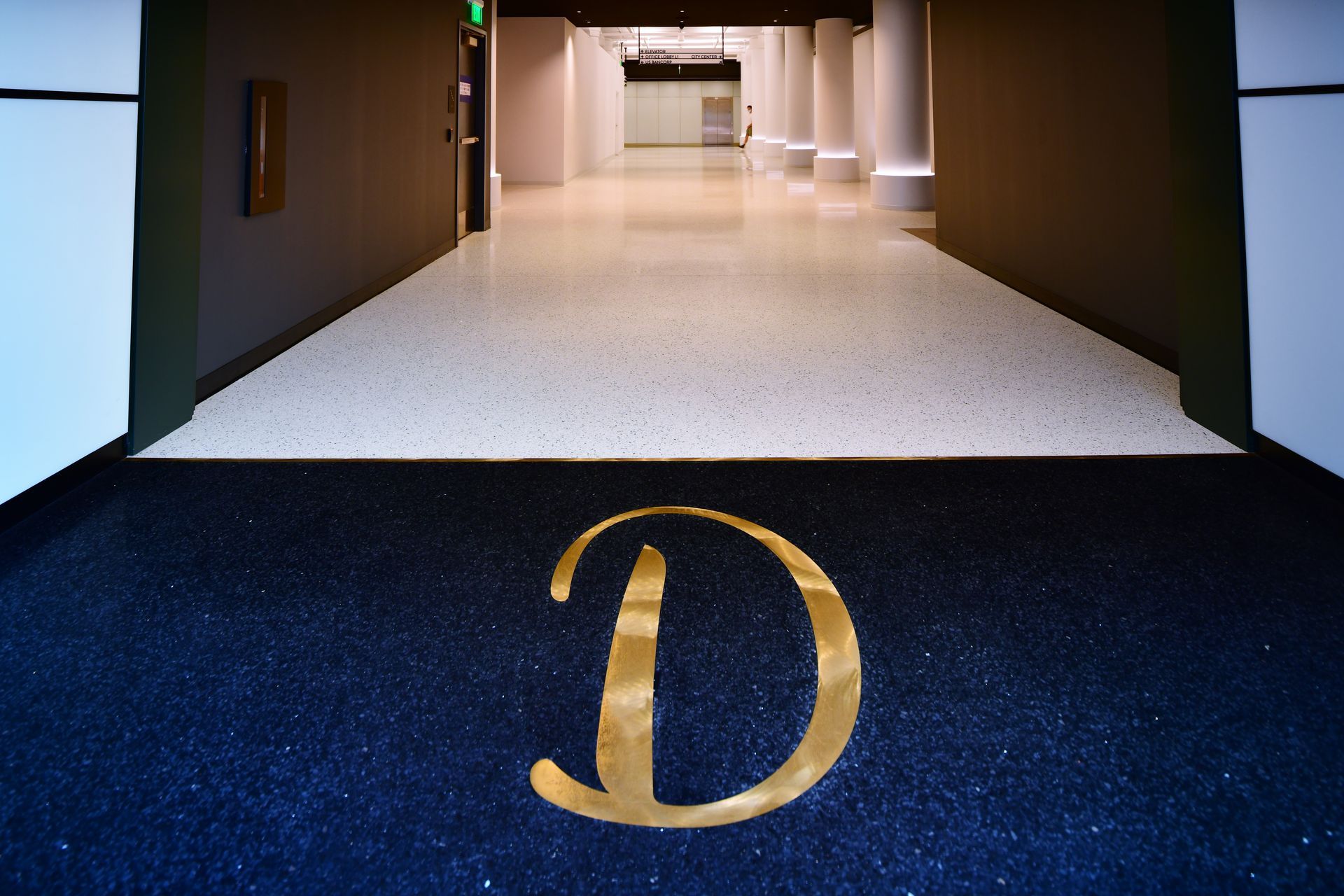A black mat with a gold letter d on it