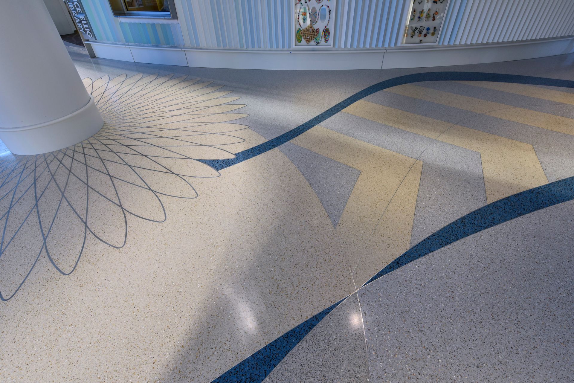 A marble floor with a blue and yellow design on it
