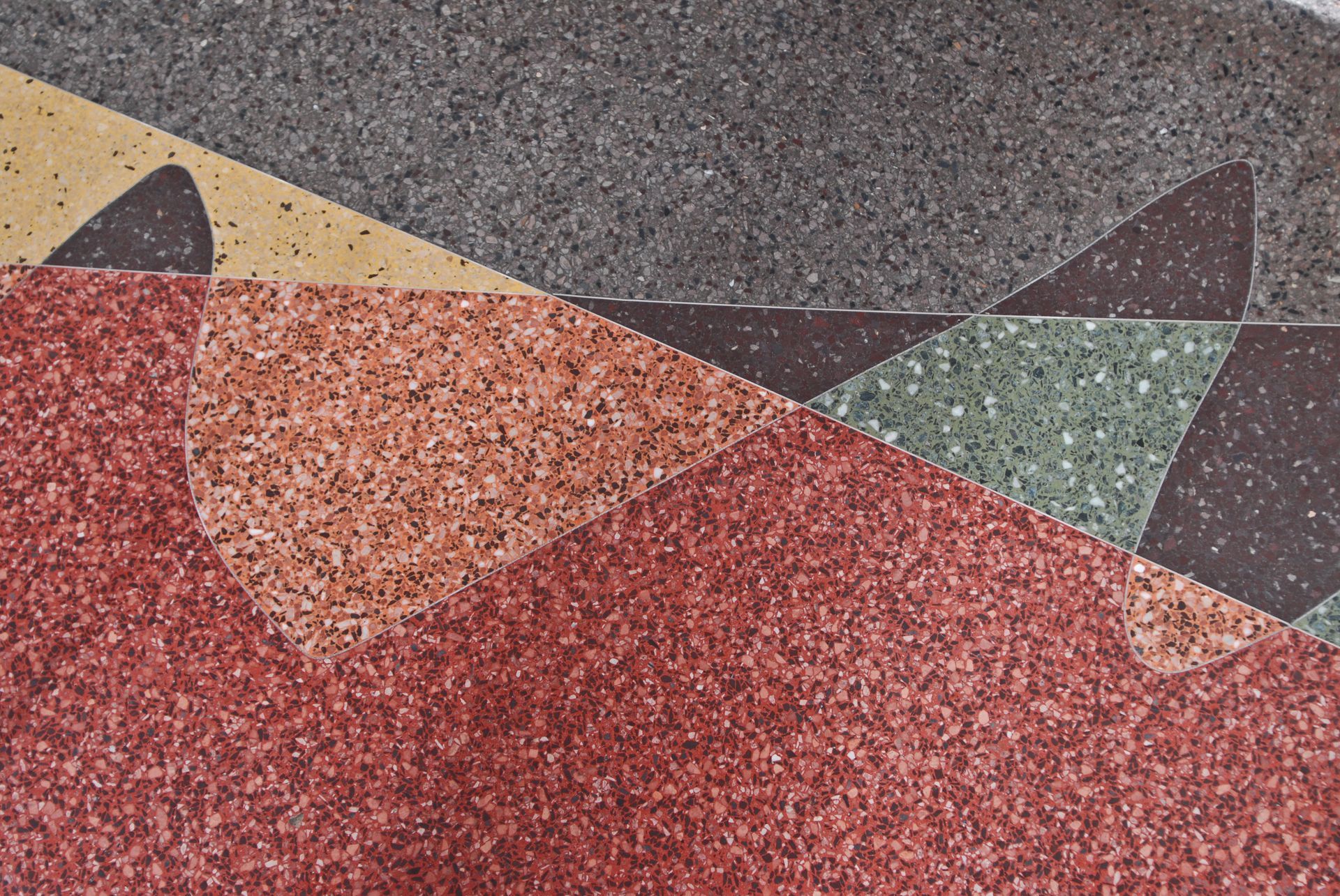 A close up of a marble floor with a geometric pattern