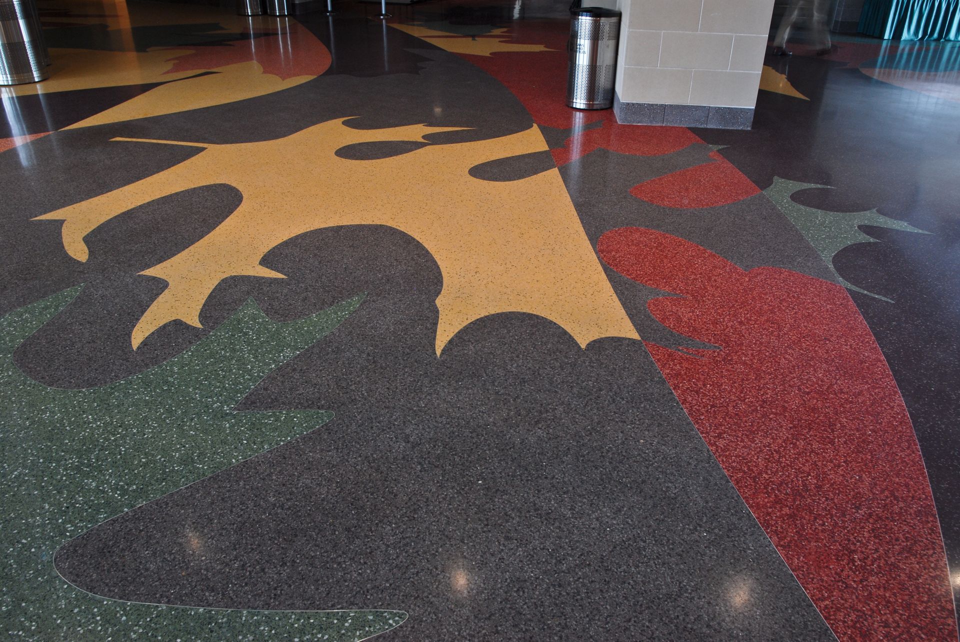 A colorful floor with a leaf design on it