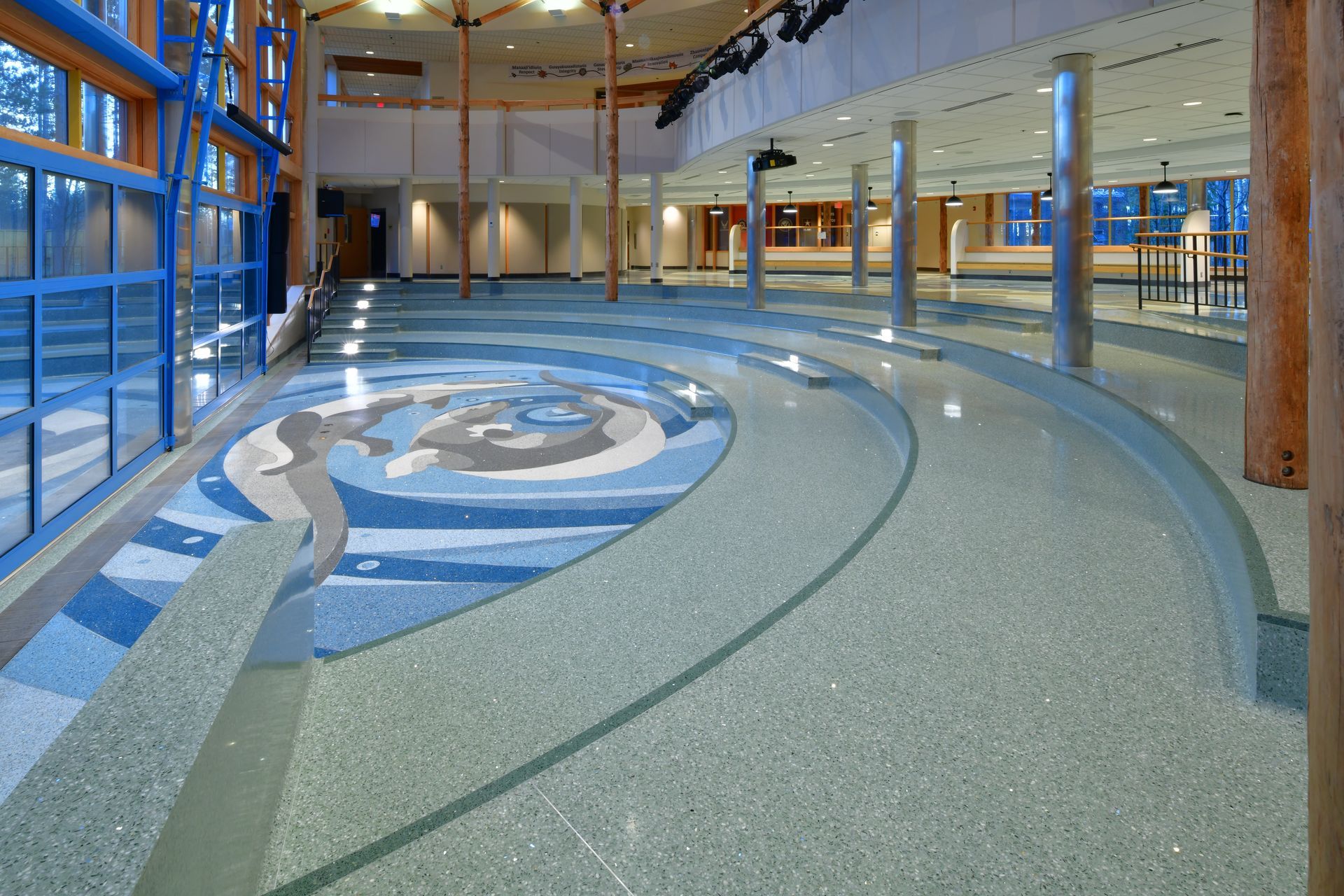 A large room with a circular pattern on the floor