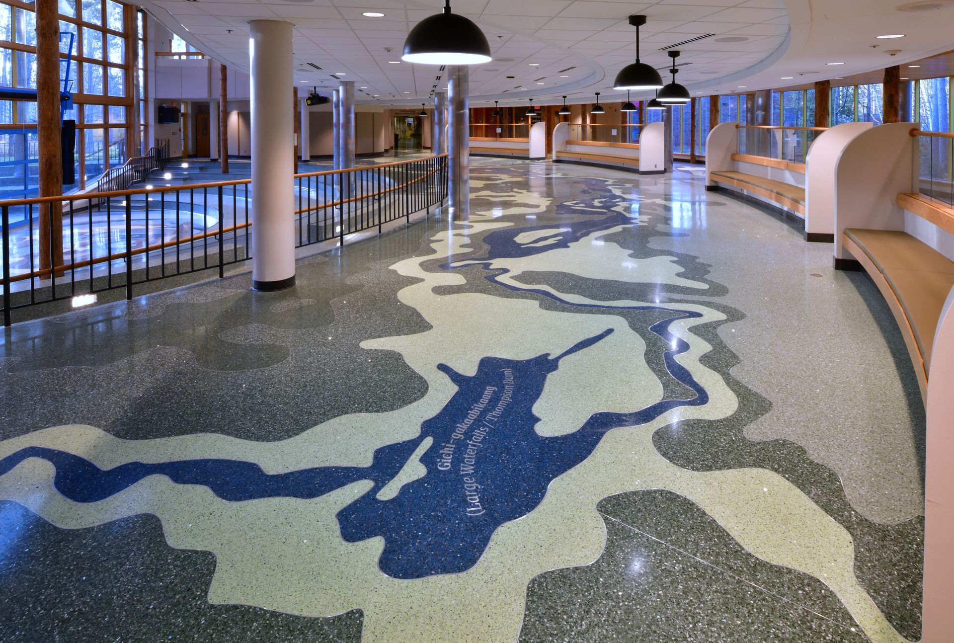 A hallway with a painting of a unicorn on the floor