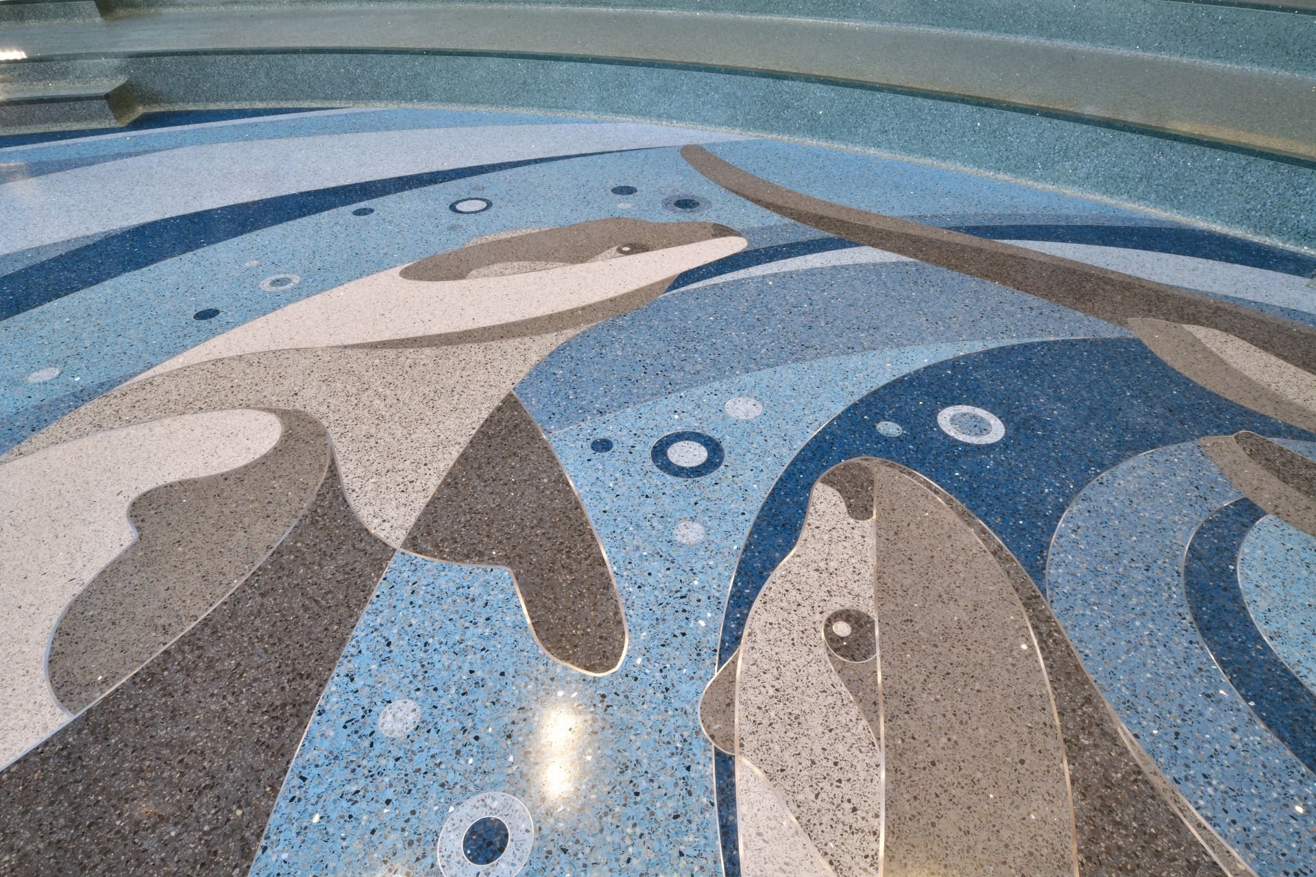 A mosaic of dolphins and penguins on the floor