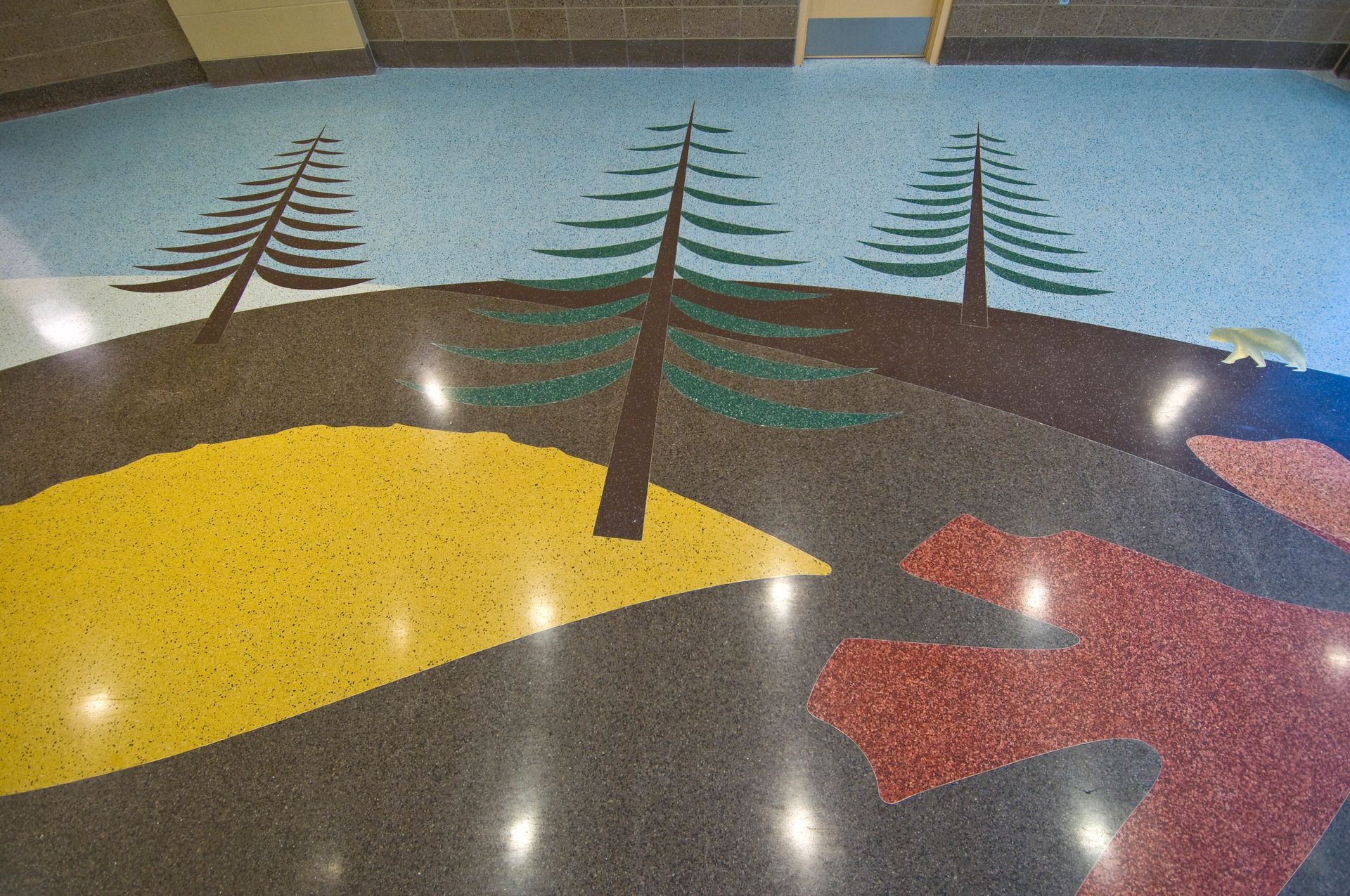 A colorful floor with trees painted on it