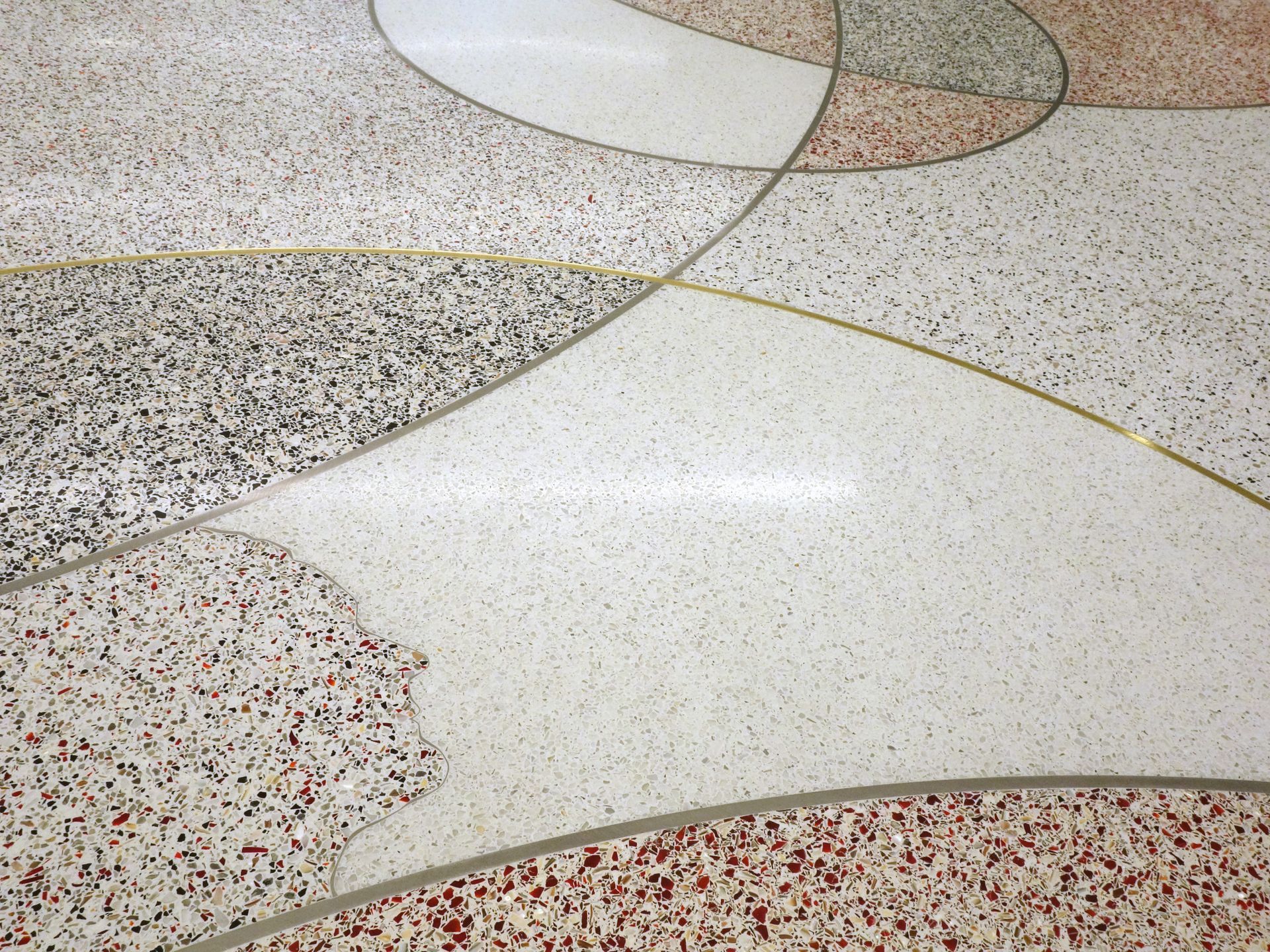 A close up of a marble floor with a circular pattern