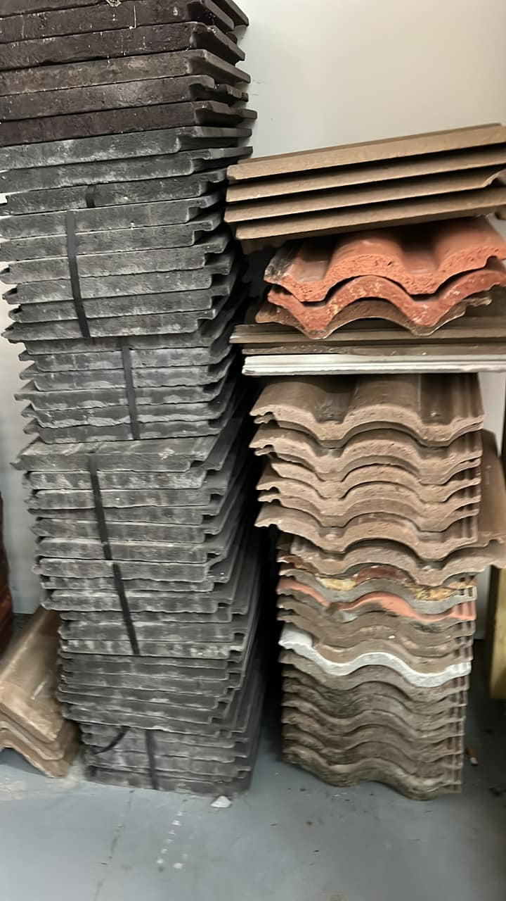 A stack of tiles sitting on top of each other in a room.