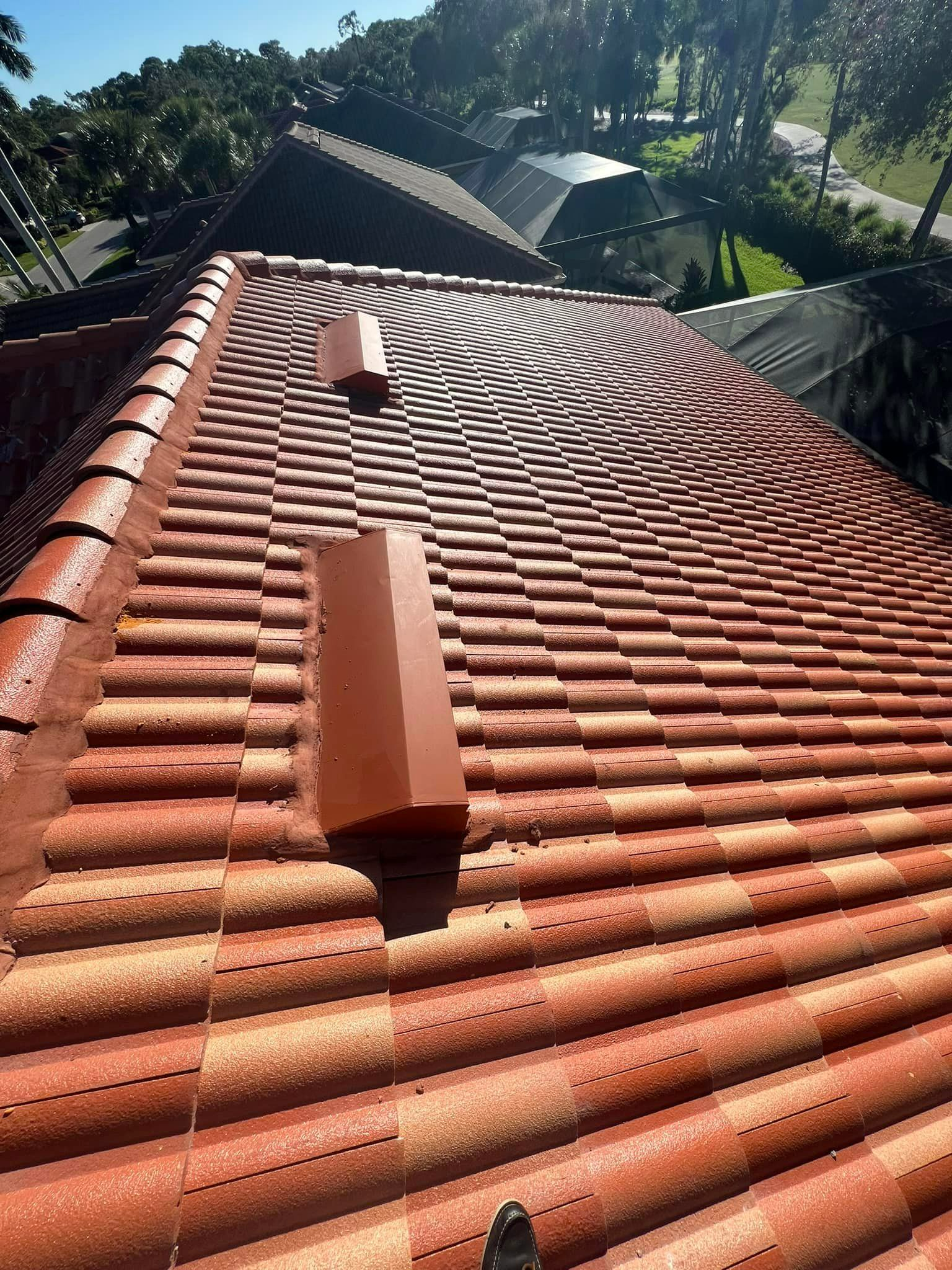 The roof of a house with a lot of tiles on it.