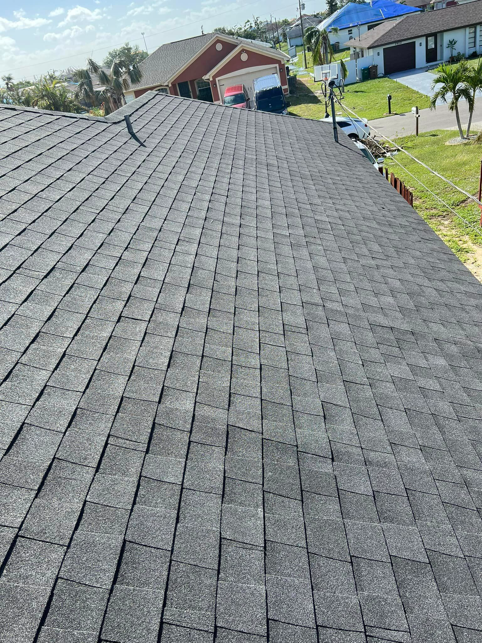 A close up of a roof with a lot of shingles on it.