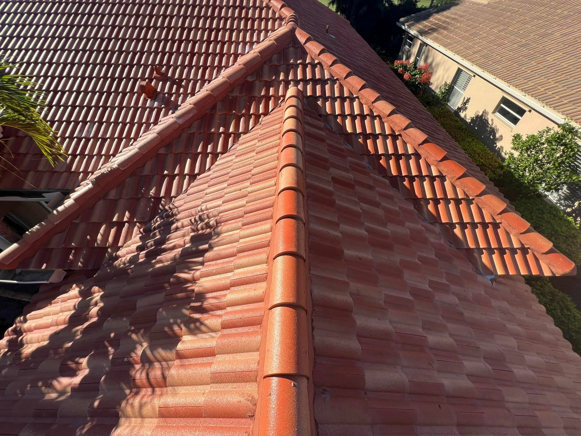 An aerial view of a tiled roof of a house.