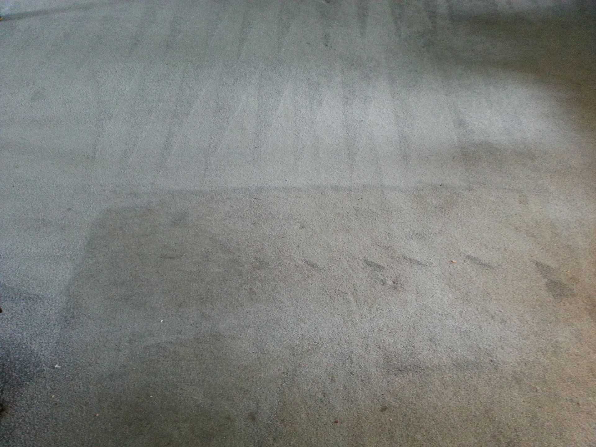 a close up of a dirty carpet in a room