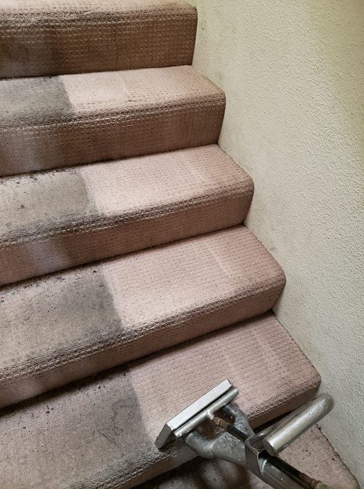 a vacuum cleaner is cleaning a set of stairs