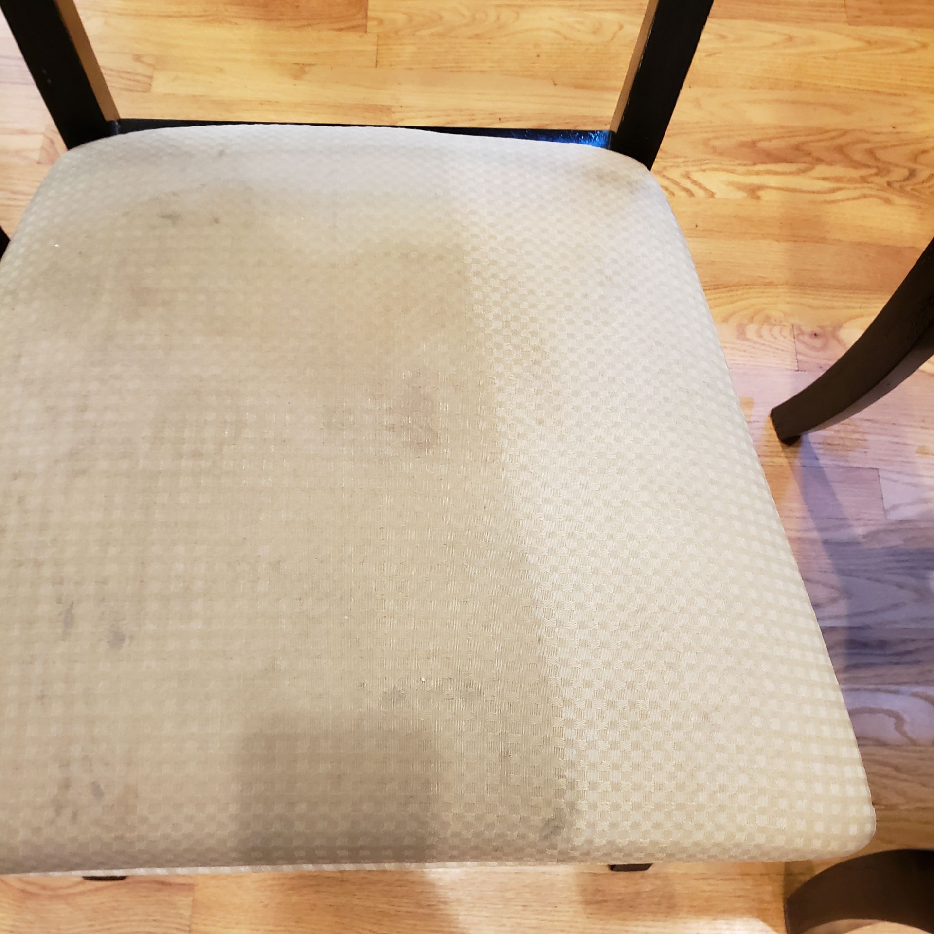 a chair is sitting on a wooden floor next to a table