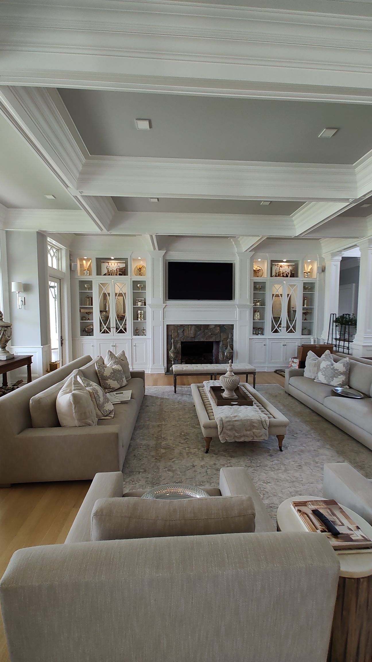 A living room filled with furniture and a fireplace.