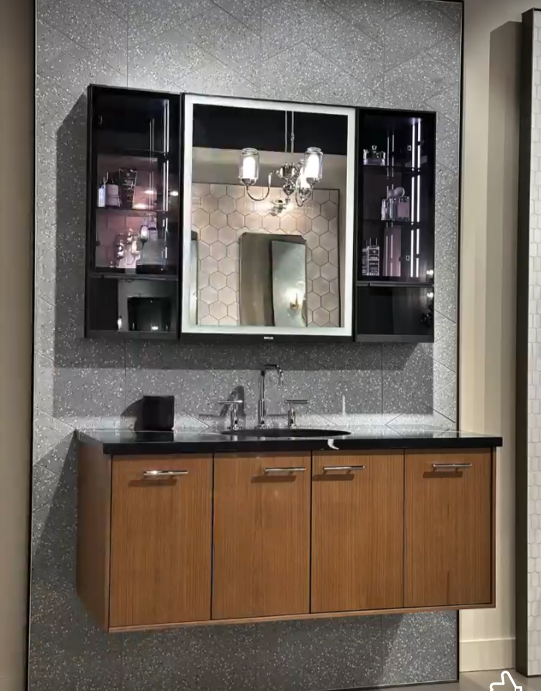 A bathroom with a sink and a mirror above it
