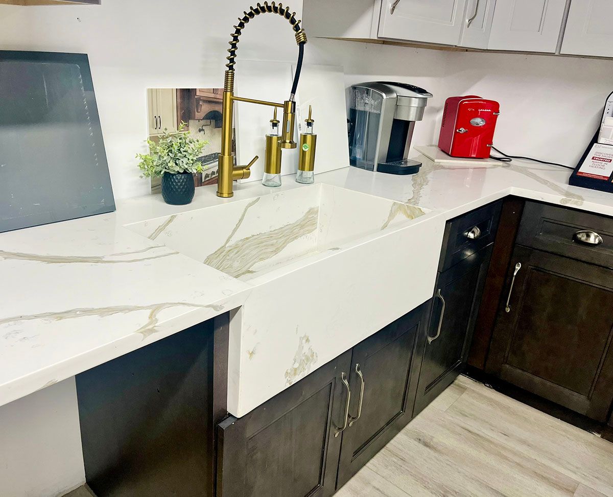 A kitchen with a sink and a coffee maker