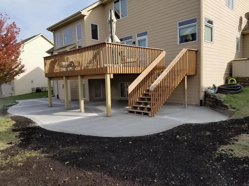 A large house with a large deck and stairs