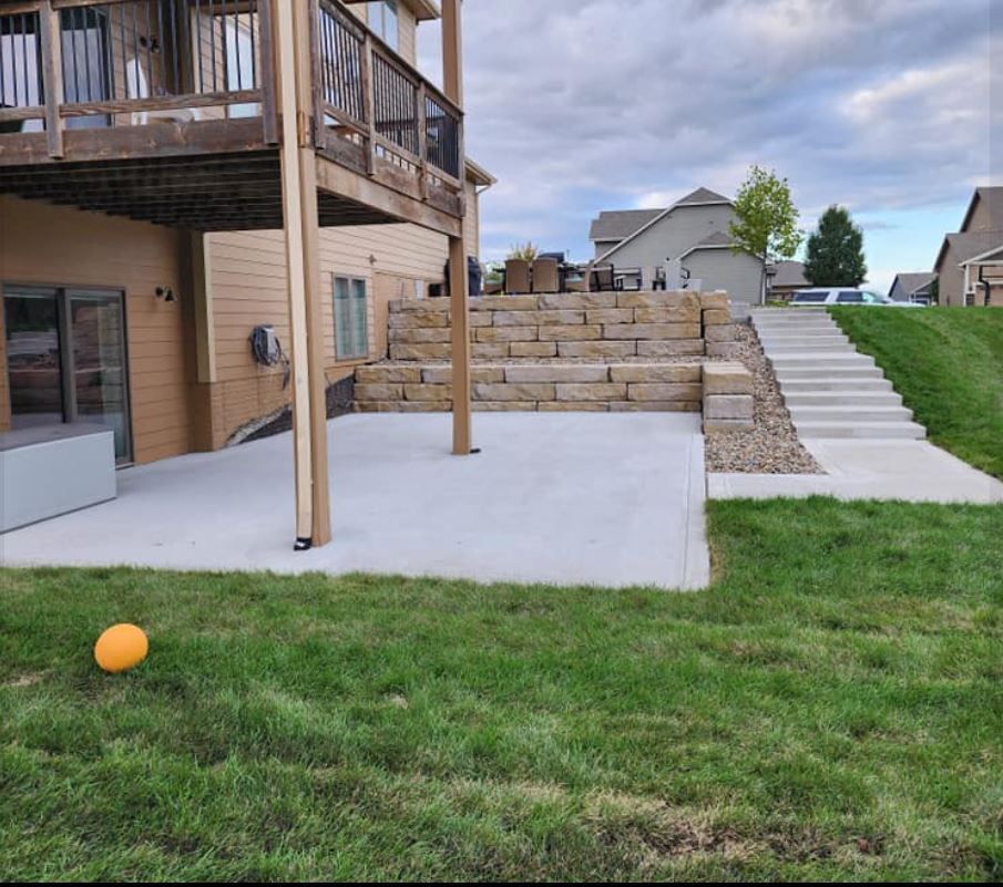 A house with a patio and stairs in front of it