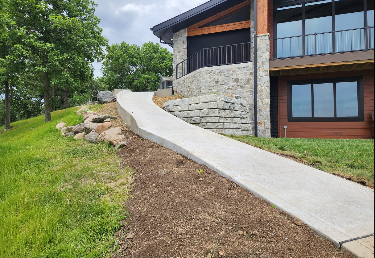 A house with a concrete patio in front of it