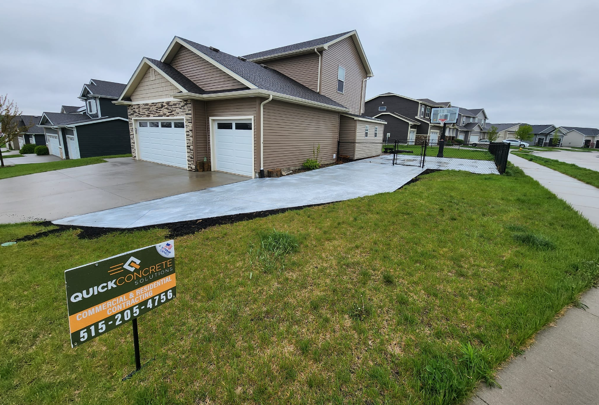 A house with a for sale sign in front of it