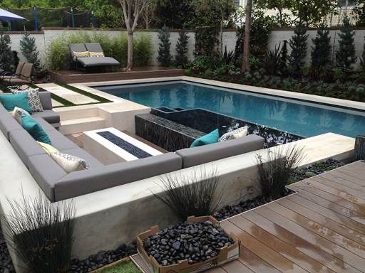 A large swimming pool with a couch in the middle of it