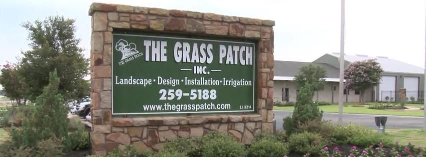 A sign that says the grass patch on it