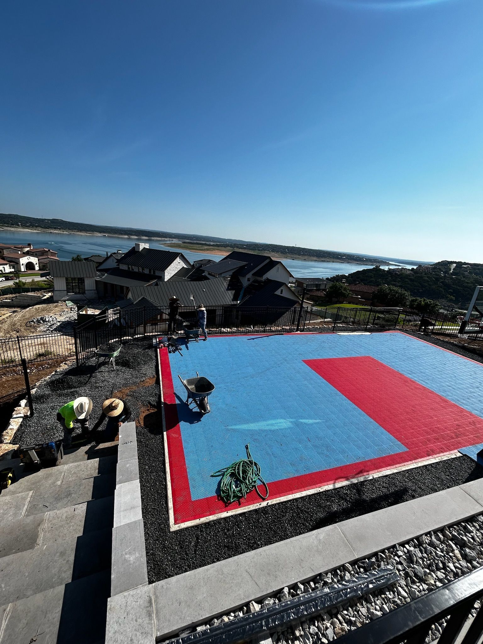 An aerial view of a blue and red karate mat
