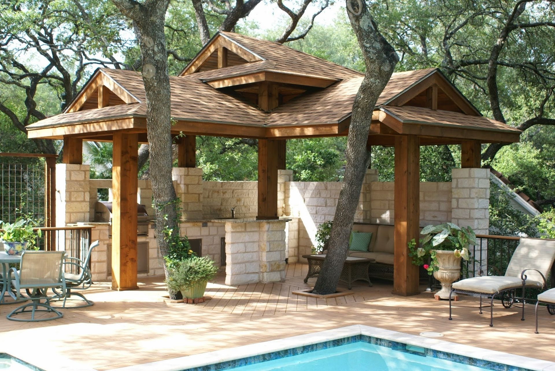 A swimming pool with a gazebo in the background