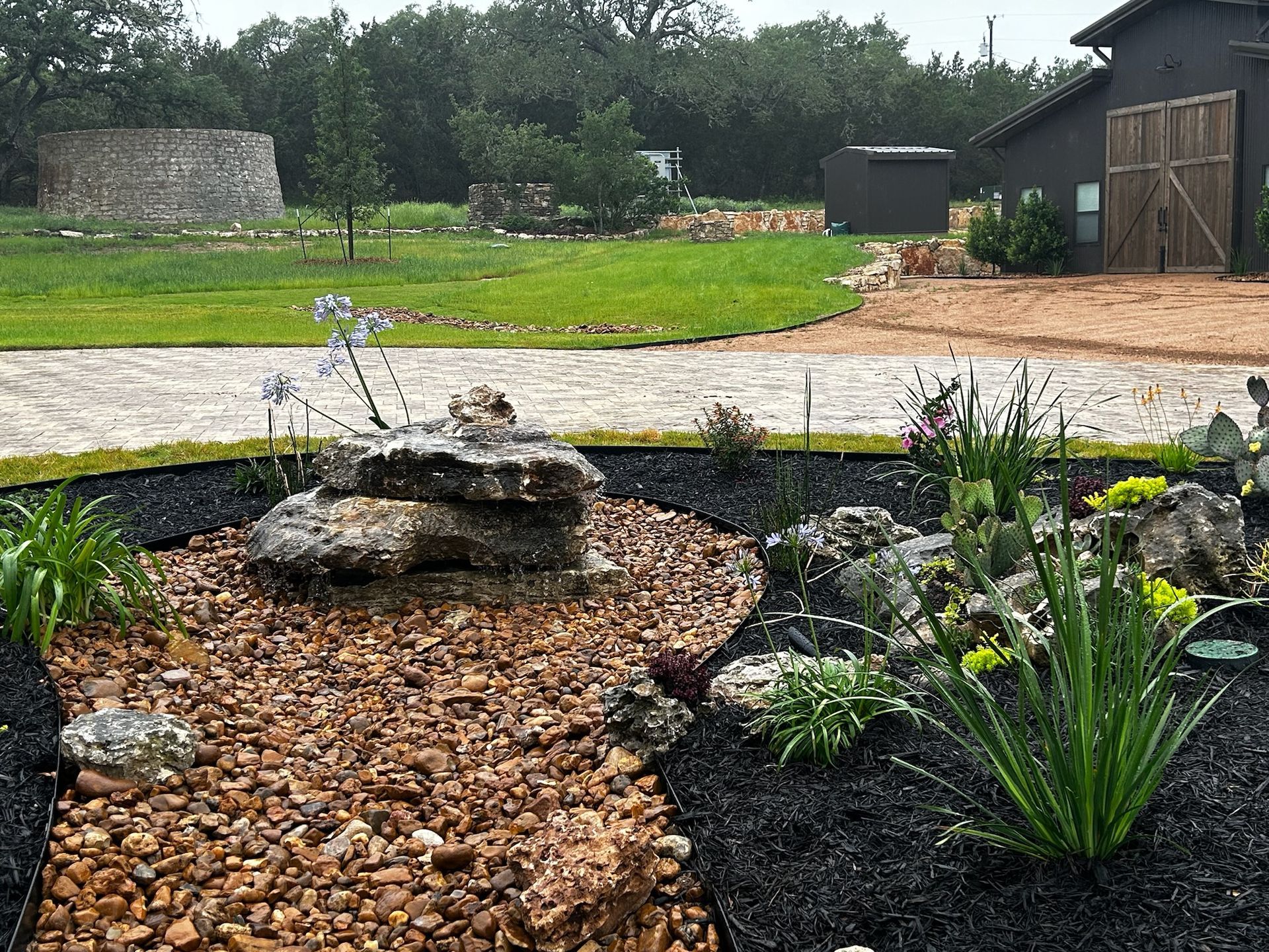 There is a waterfall in the middle of the garden.