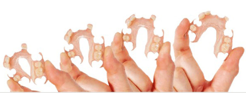 Hands holding dentures
