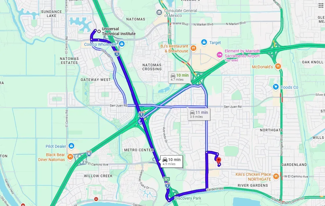 Map with blue and green route lines over a city street grid.