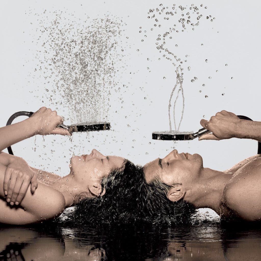 A man and a woman are taking a shower together