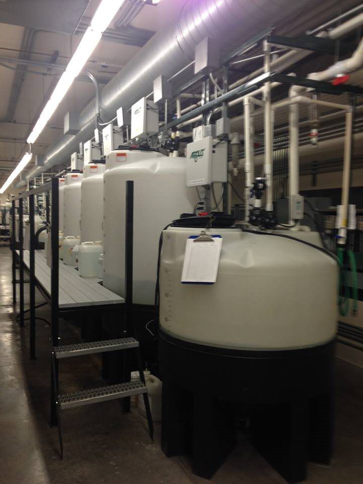 A large room with lots of tanks and pipes