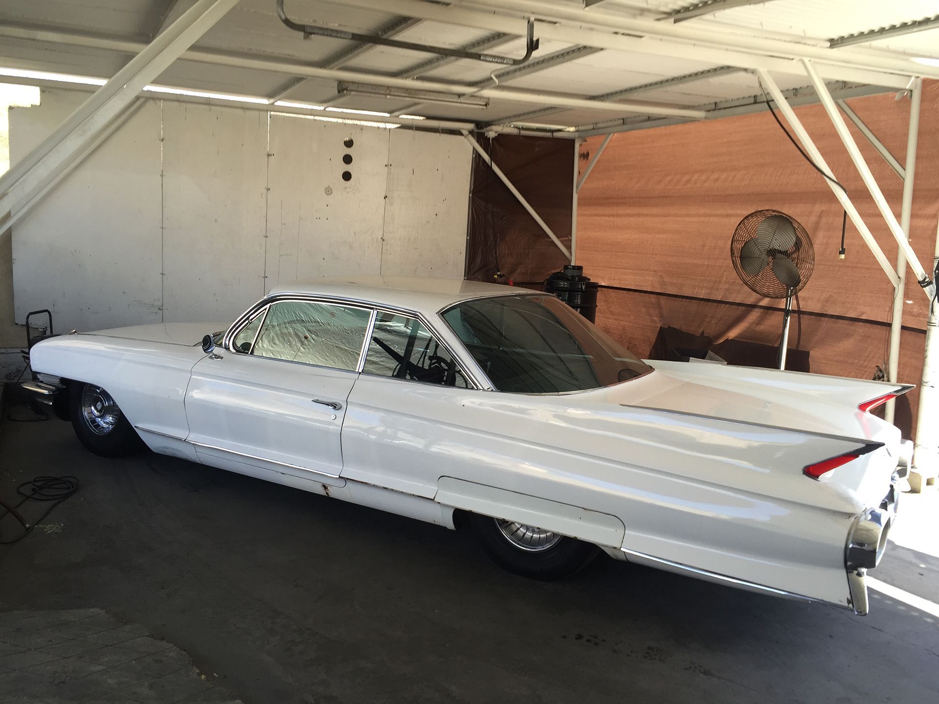 White Cadillac Coupe DeVille side view