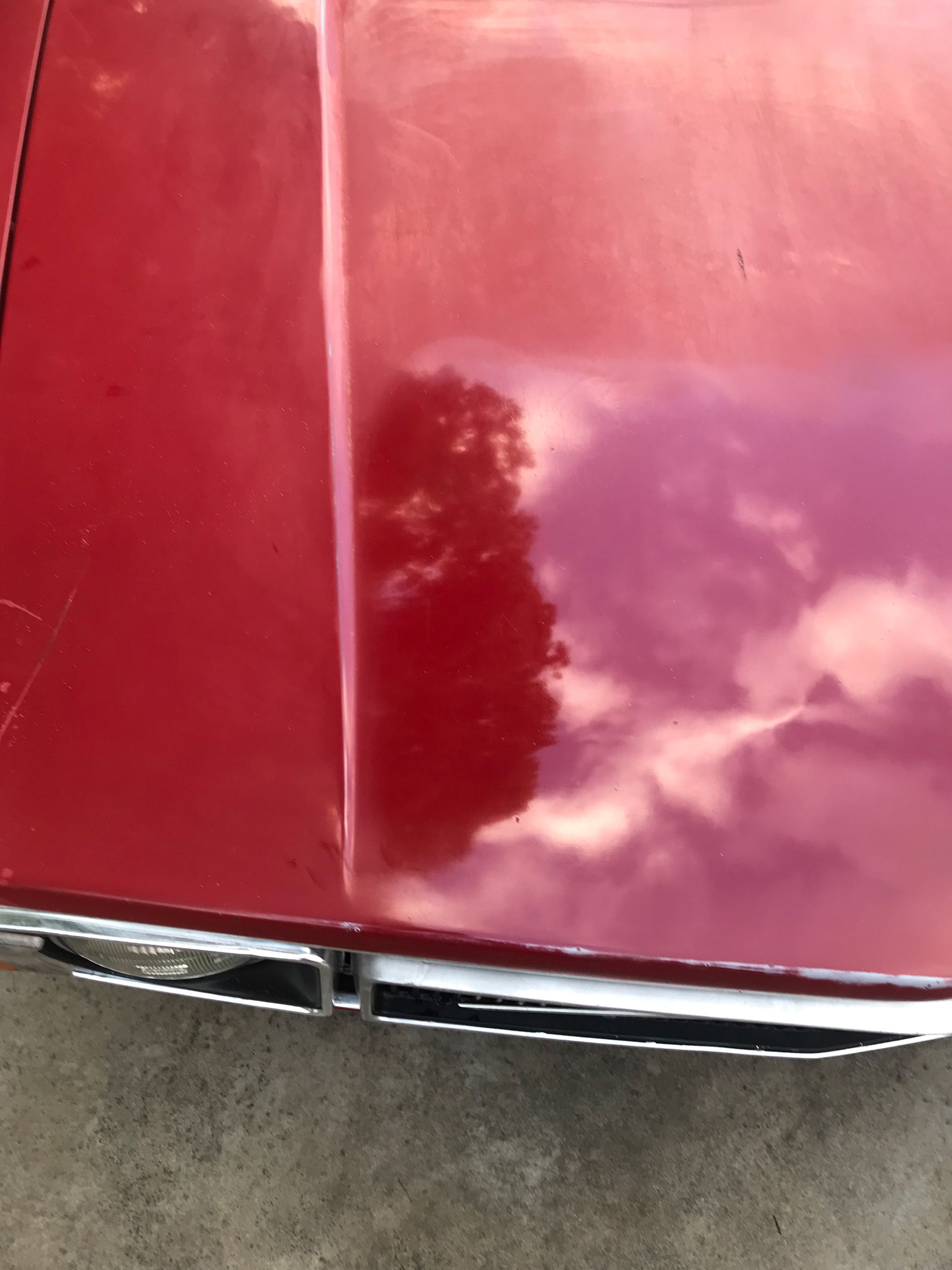 Volvo Coupe hood with sky's reflection