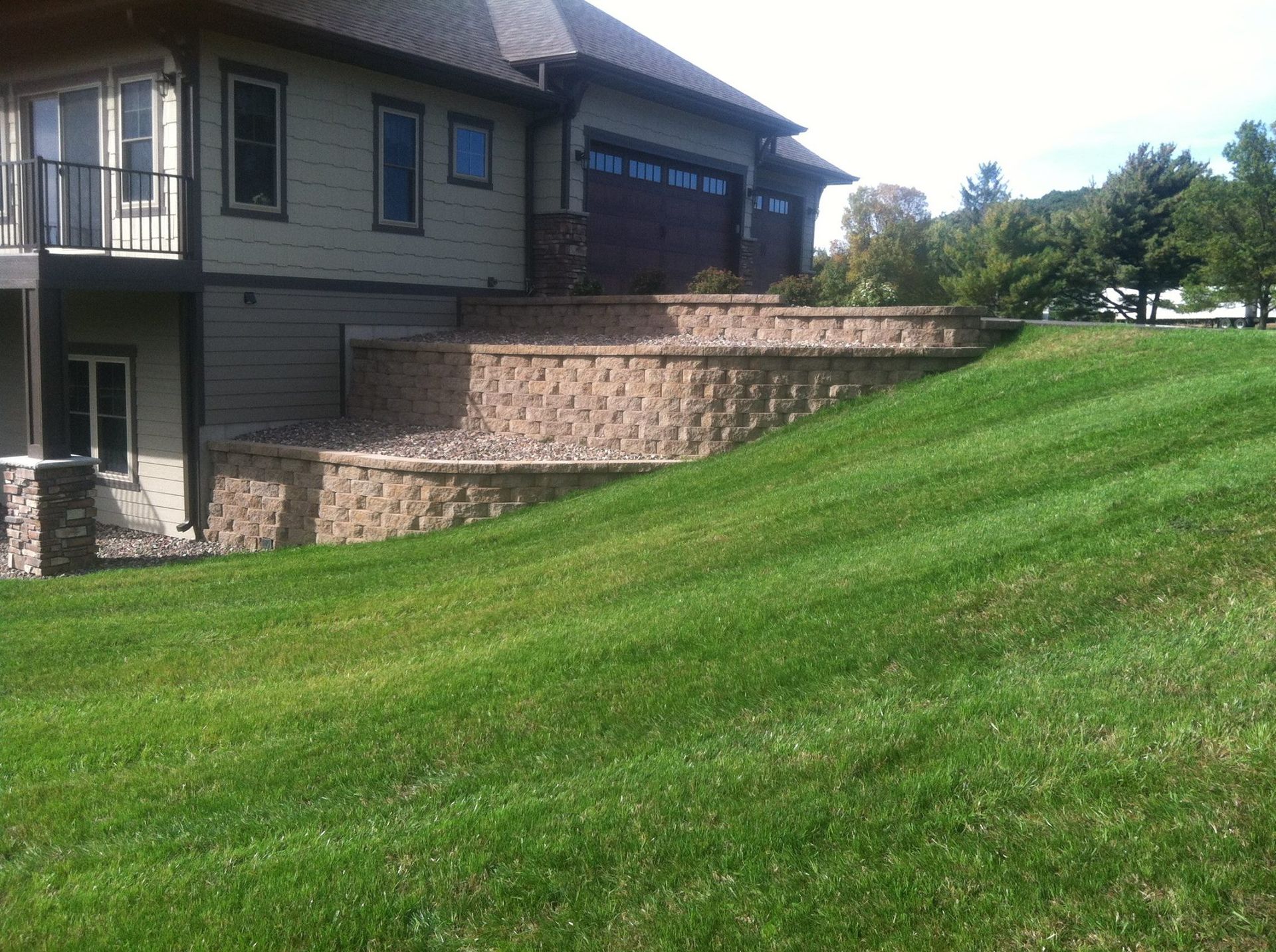 A large house with a large lawn in front of it.