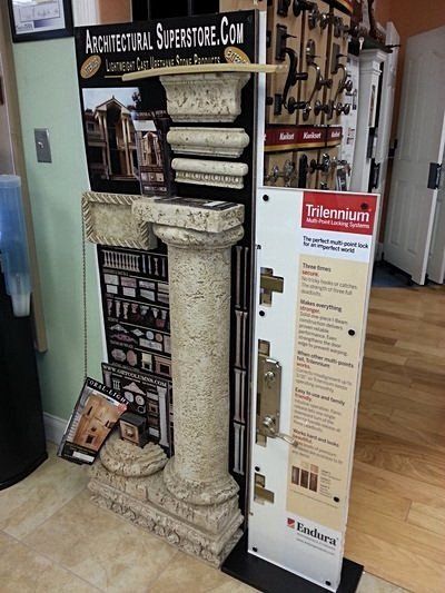 Display with stone column and door hardware at Architectural Superstore.
