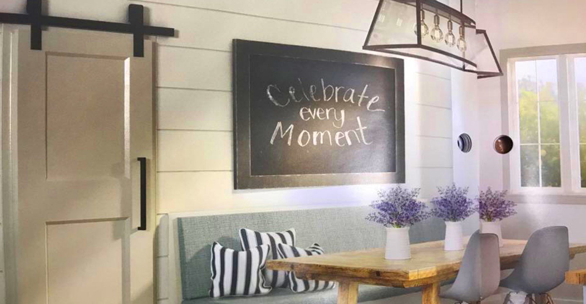 Dining room with a chalkboard sign that reads