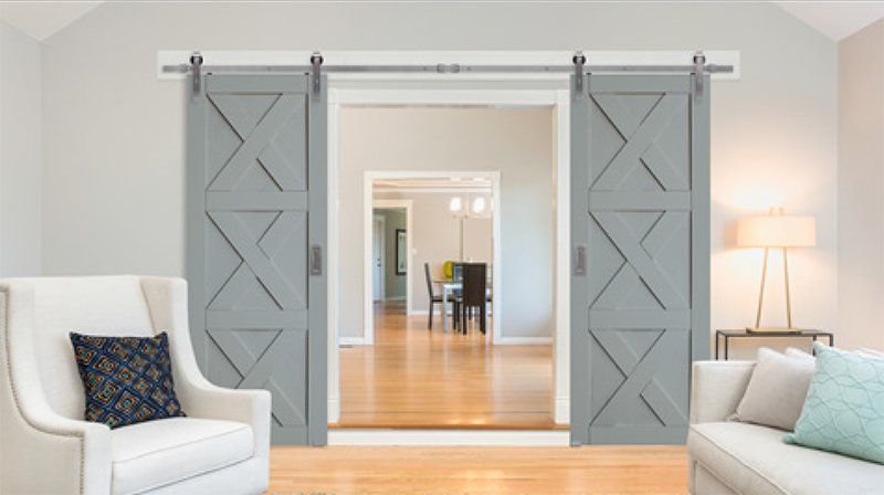 Dark brown sliding barn doors with mirrors, interior bedroom view.