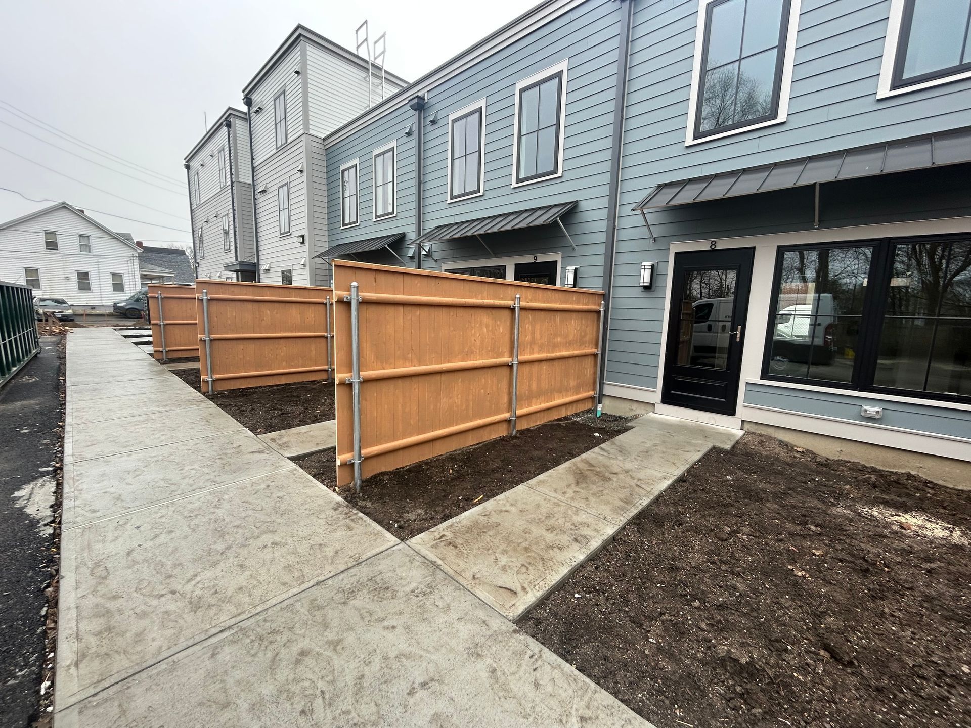 A building with a wooden fence in front of it