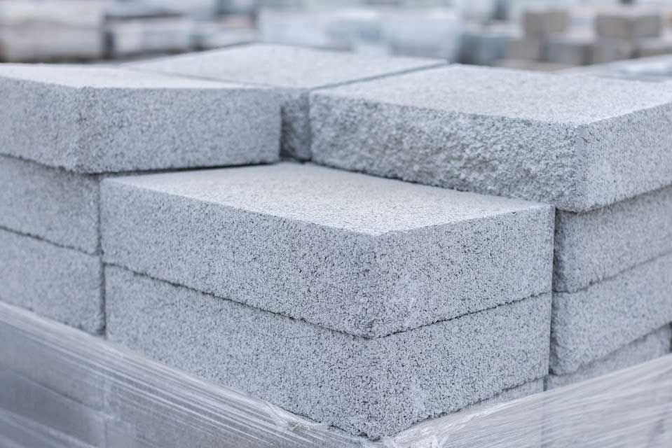 Stack of gray concrete blocks, likely for construction.