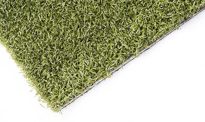 Close-up of artificial grass; green blades on a black backing.