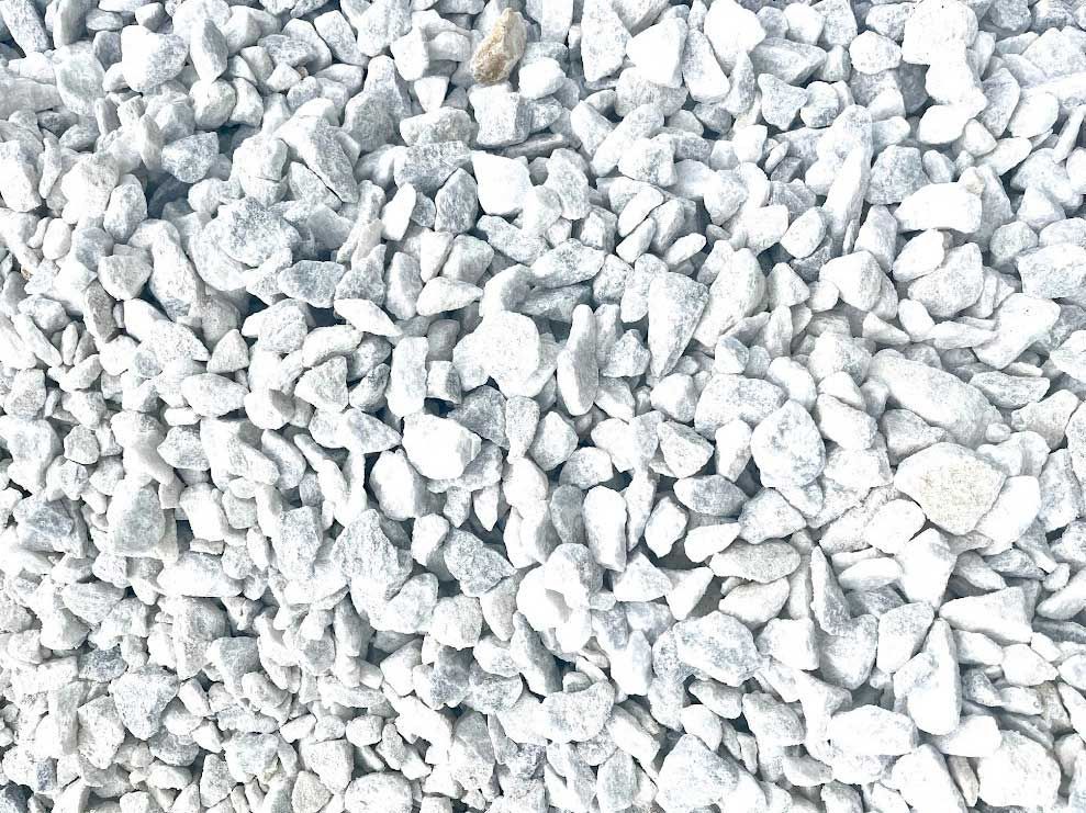 Pile of small, light-colored gravel stones.