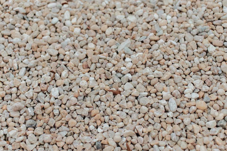 Small, beige gravel stones scattered densely.