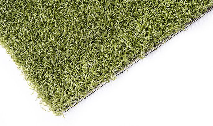 Green artificial turf, showing dense blades and a black backing, on a white background.