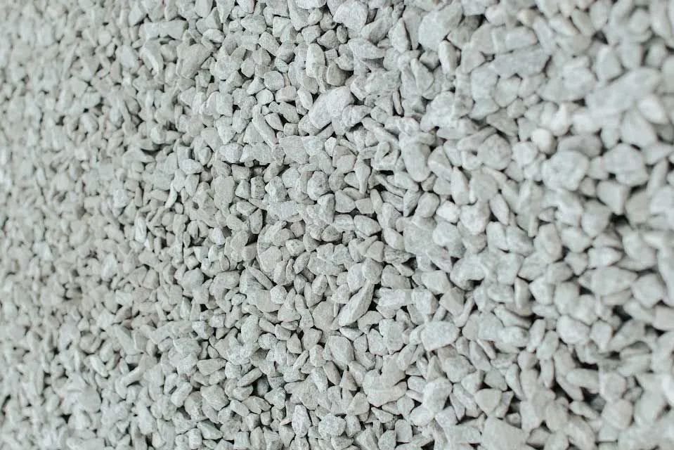 Close-up of a pile of small, light gray gravel stones.