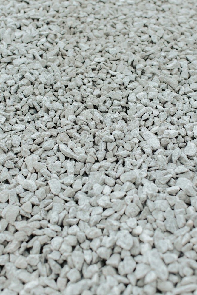 Close-up of a pile of light gray gravel.