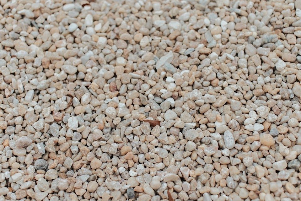 Close-up of small, light-colored gravel stones.